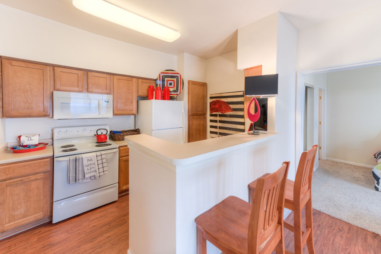 apartment kitchen with white appliances
